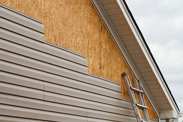 Professional Storm Damage Siding Repair technician working in South Park, PA